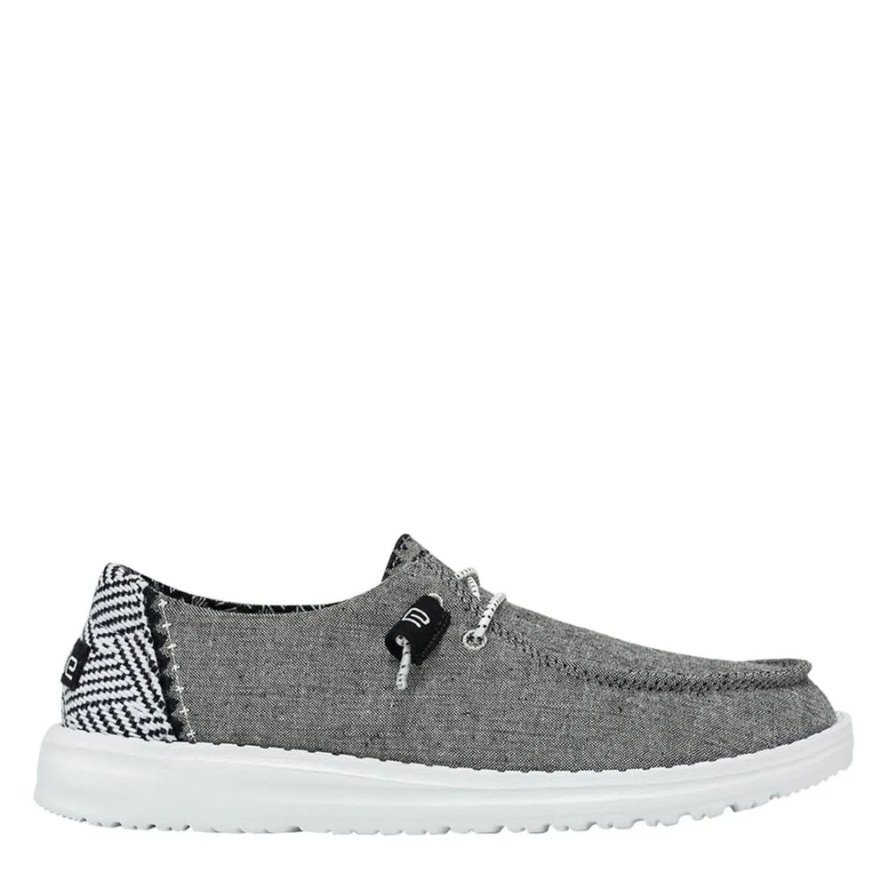 HEYDUDE  WOMENS WENDY CHAMBRAY SLIP ON SNEAKER